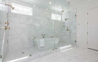 Large custom master bath with two showers and bathtub