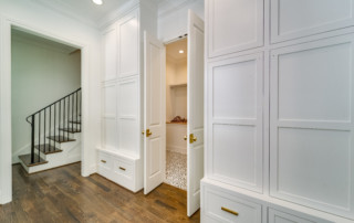 Walk in closet in custom built home entryway