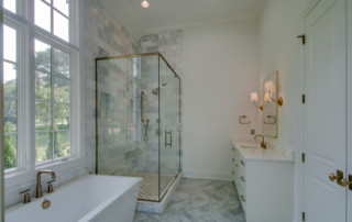 Custom master bathroom with shower and bathtub