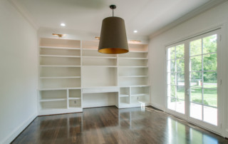 Study with custom shelving built into wall