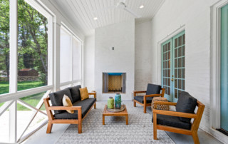 Enclosed porch with porch seating and fireplace