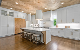 Wood paneled ceiling in kitchen with island