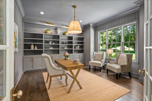 Beautiful gray walled study with built in shelves