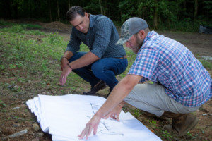 Baird & Ken with BGC looking over home blueprints