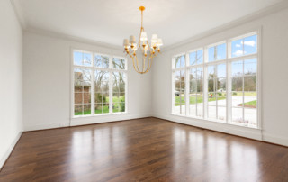 Beautiful dining area with large windows overlooking front yard