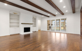 Custom built home living room with fireplace and display shelves