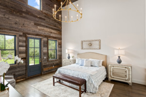 Master bedroom with barnwood exterior wall