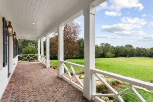 Exterior brick porch with view of backyard