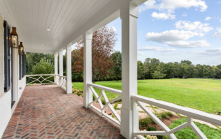 Exterior brick porch with view of backyard